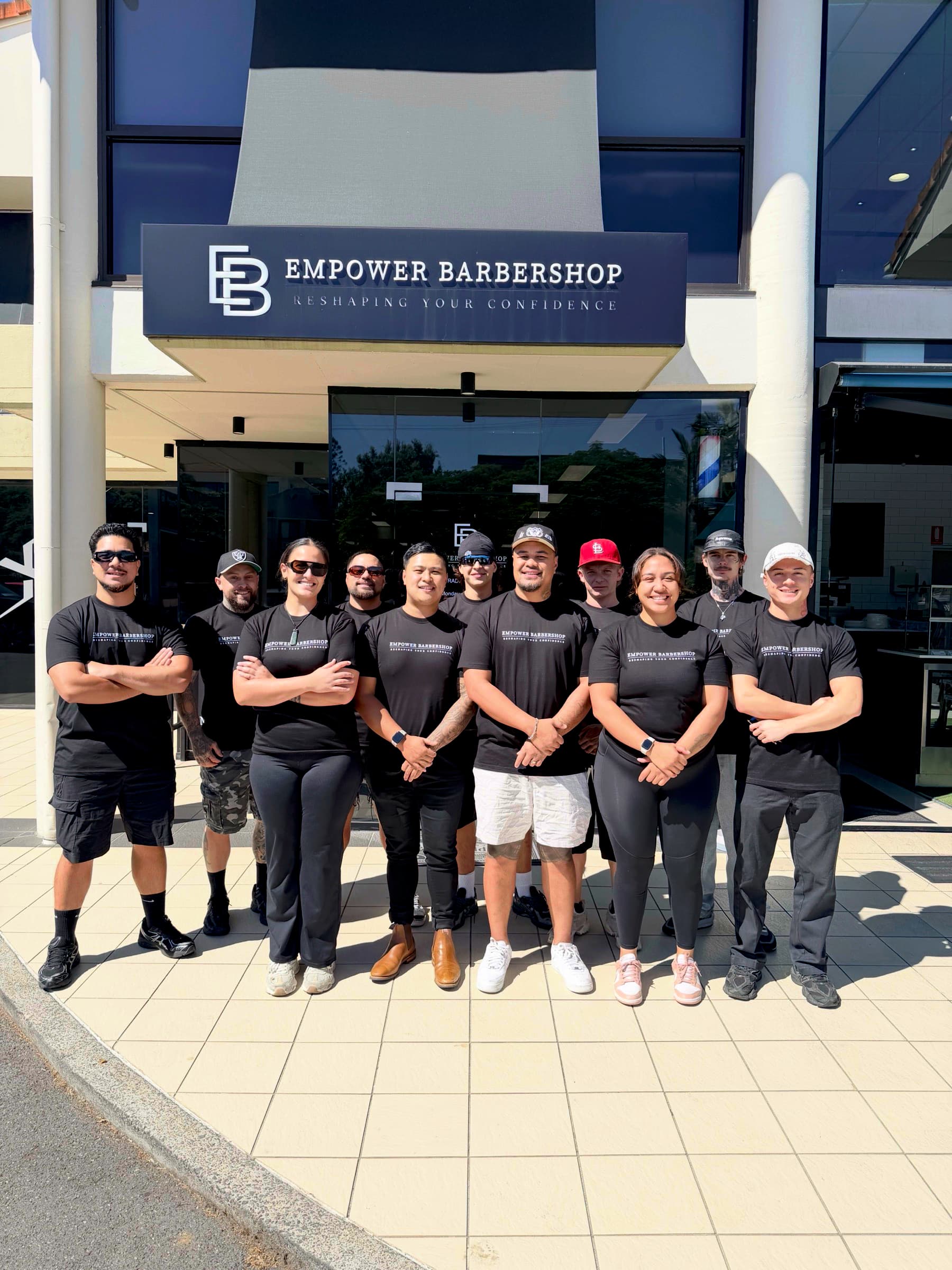 The Empower Barbershop team outside the shop