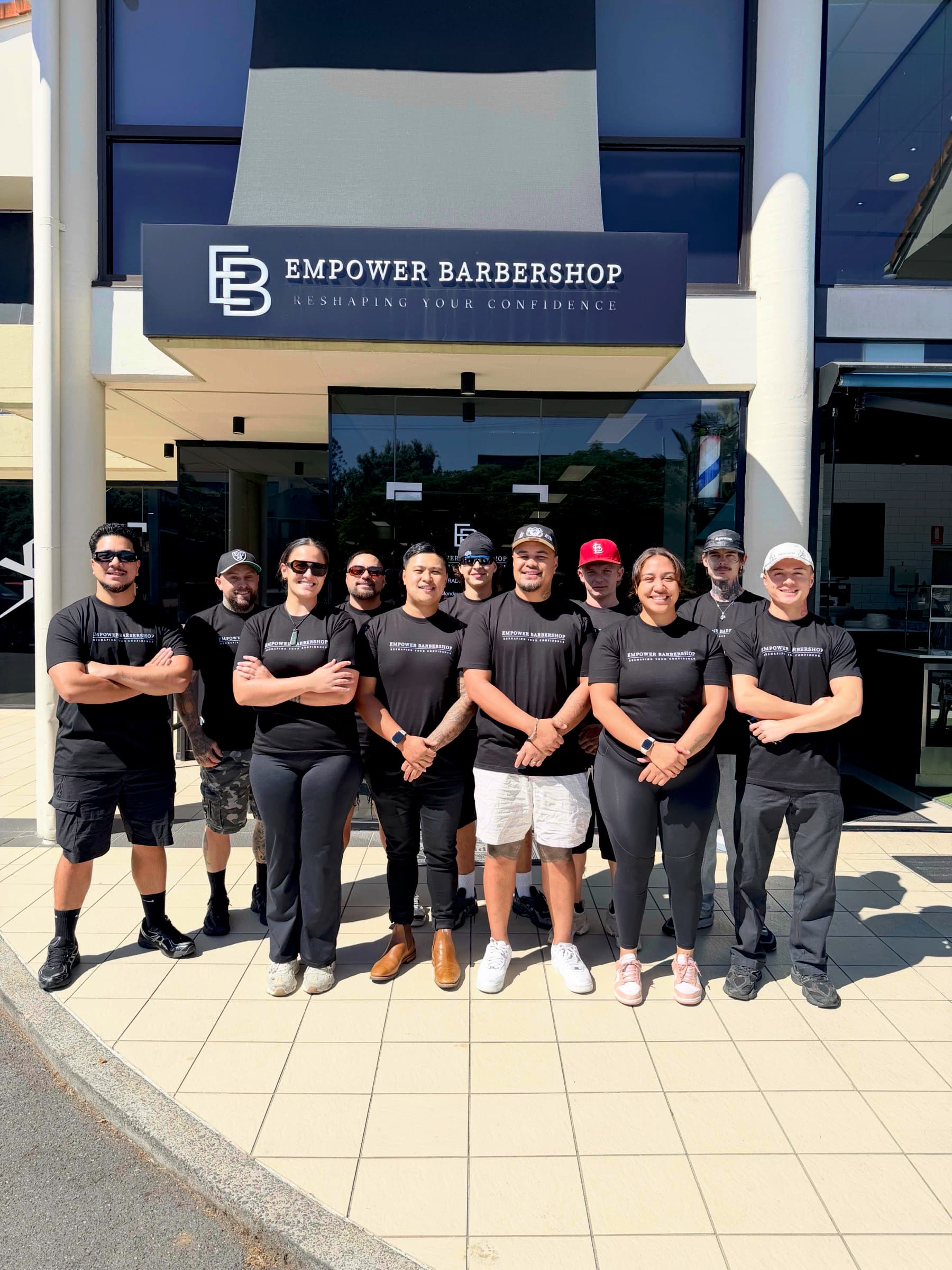 The Empower Barbershop team outside the shop
